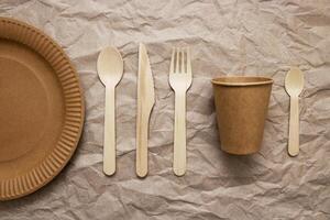 A set of disposable tableware on a paper background photo
