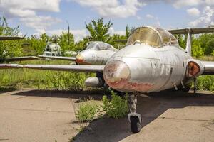 Old abandoned airfield with abandoned planes. Abandoned rusty old planes photo