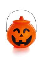 Jack o' Lantern pumpkin basket to collect candy on Halloween on white background photo