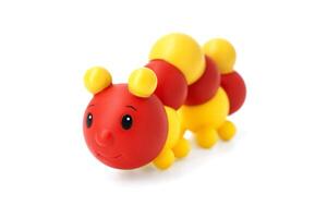 Childrens rubber toy caterpillar isolated on white background photo