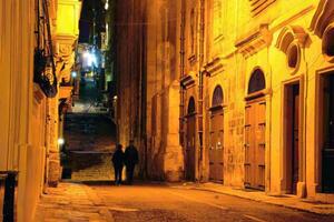 Narrow street at night photo