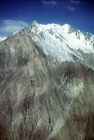 Steep mountain peak and glacier in the Pamirs photo