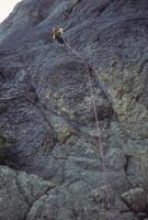 Climber rappelling from Liberty Bell photo