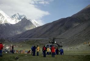 Climbers and Soviet helicopter photo