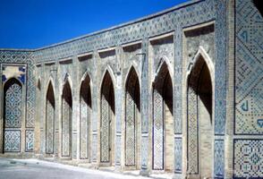 Mosaic tiled arches in mosque courtyard photo