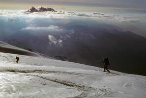 Telemark skiers on ascent of Mt Baker photo