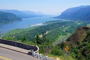 Forests cover the steep cliffs of the Columbia Gorge photo
