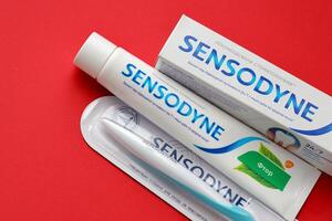 KYIV, UKRAINE - MAY 4, 2022 Sensodyne fluorine or fluor is a daily fluoride toothpaste photo