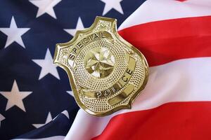 KYIV, UKRAINE - MARCH 9, 2024 US Special Police badge on United States of America flag photo