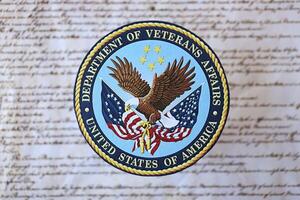 KYIV, UKRAINE - MARCH 9, 2024 US Department of Veteran Affairs seal on United States Constitution photo