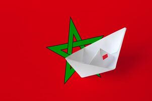 Morocco flag depicted on paper origami ship closeup. Handmade arts concept photo