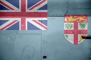 Fiji bandera representado en lado parte de militar blindado helicóptero de cerca. Ejército efectivo aeronave conceptual antecedentes foto