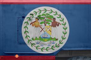 Belize flag depicted on side part of military armored truck closeup. Army forces conceptual background photo