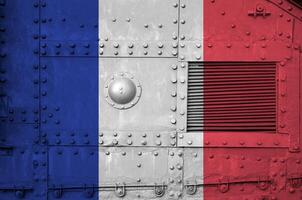 France flag depicted on side part of military armored tank closeup. Army forces conceptual background photo