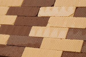 Stacked delicious chocolate wafers in large amount. Two different flavours of classic waffles photo