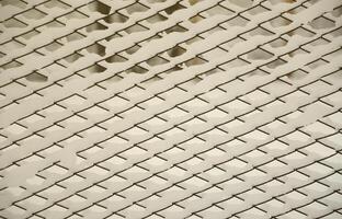 Close-up metal mesh covered with a thick layer of snow in the cells photo