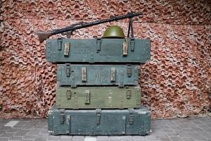 Soviet army ammunition stack of green crates with russian names of ammo type and category photo