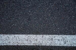 Surface grunge rough of asphalt. Tarmac dark grey grainy road. Texture Background Top view photo