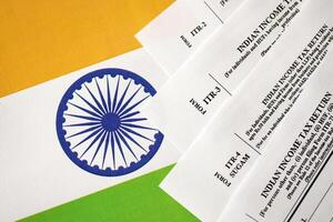 Indian income tax return blank forms on indian country flag photo