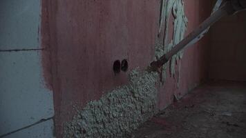 Applying plaster machine to the wall in an apartment video