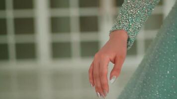 Close-up of a woman's hand pointing towards the camera, blurred background, concept of choice or accusation. video