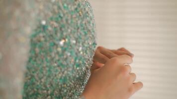 Side profile of a serene young woman with a subtle smile, soft-focus background, warm indoor lighting. video