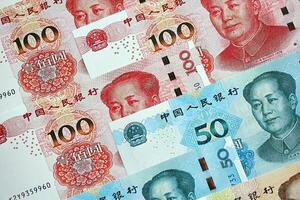 Many money bills of People Republic of China. PRC Yuan banknotes photo