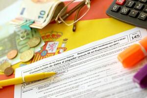 KYIV, UKRAINE - MAY 4, 2022 Modelo 145 spanish tax form dedicated to personal income tax IRPF photo