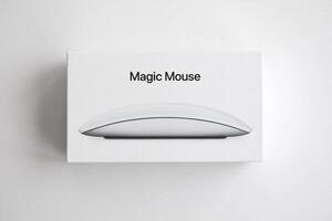 KYIV, UKRAINE - NOVEMBER 27, 2023 Apple Magic Mouse 3rd generation lies on white background photo