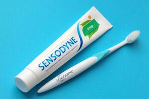 KYIV, UKRAINE - MAY 4, 2022 Sensodyne fluorine or fluor is a daily fluoride toothpaste photo