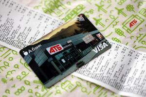 KYIV, UKRAINE - 4 MAY, 2023 ATB supermarket discount VISA card for low prices on different goods and products photo