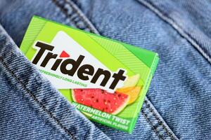 KYIV, UKRAINE - NOVEMBER 27, 2023 Trident chewing gum pack. Trident is famous US chewing gum brand photo