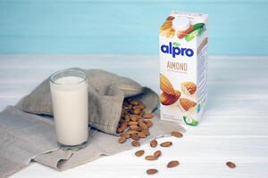 KHARKIV, UKRAINE - JANUARY 2, 2021 Alpro almond vegetarian milk pack produced by European company based in Wevelgem photo