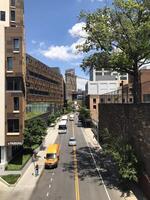 05 June, 2023 - United States, New York, Brooklyn - Fulton Ferry - Manhattan Bridge view from the side street with cars on the road. photo