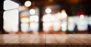 AI generated Empty wooden table top with lights bokeh on blur restaurant background. photo
