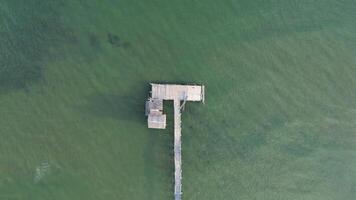 Aerial view of wooden pier in the sea photo