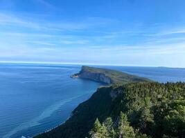 clear blue water of the ocean seen from a mountain photo