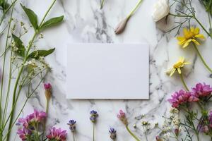 AI generated Blank white card on Marble table with meadow spring flowers around, top view. Festive floral summer arrangement mockup for invitations and contact details. Springtime copy space photo