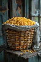 AI generated Yellow corn in basket on wooden table photo