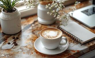 ai generado taza de café con ordenador portátil cuaderno y flores en de madera mesa foto