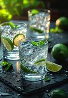 AI generated Three glasses of gin and tonic with lime and mint on slate photo
