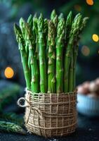 AI generated Fresh green asparagus on dark background photo