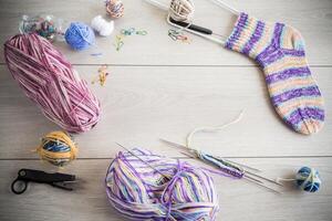 Colored threads, knitting needles and other items for hand knitting photo