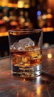ai generado vaso de whisky con hielo cubitos en el de madera bar mostrador foto