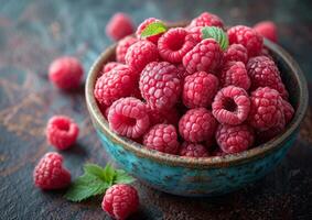 AI generated Fresh raspberries in bowl on dark rustic background photo