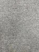 Seamless close up of monochrome grey carpet texture background from above. photo