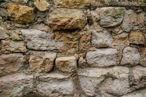 Background of masonry stones, rocky wall photo