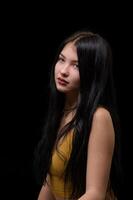 studio portrait of a young girl in torn jeans 2 photo