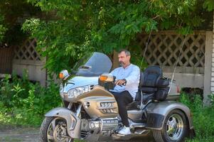 man sitting on a motorcycle 2 photo