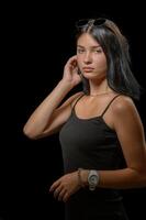 studio portrait of a young girl in a little black dress 2 photo